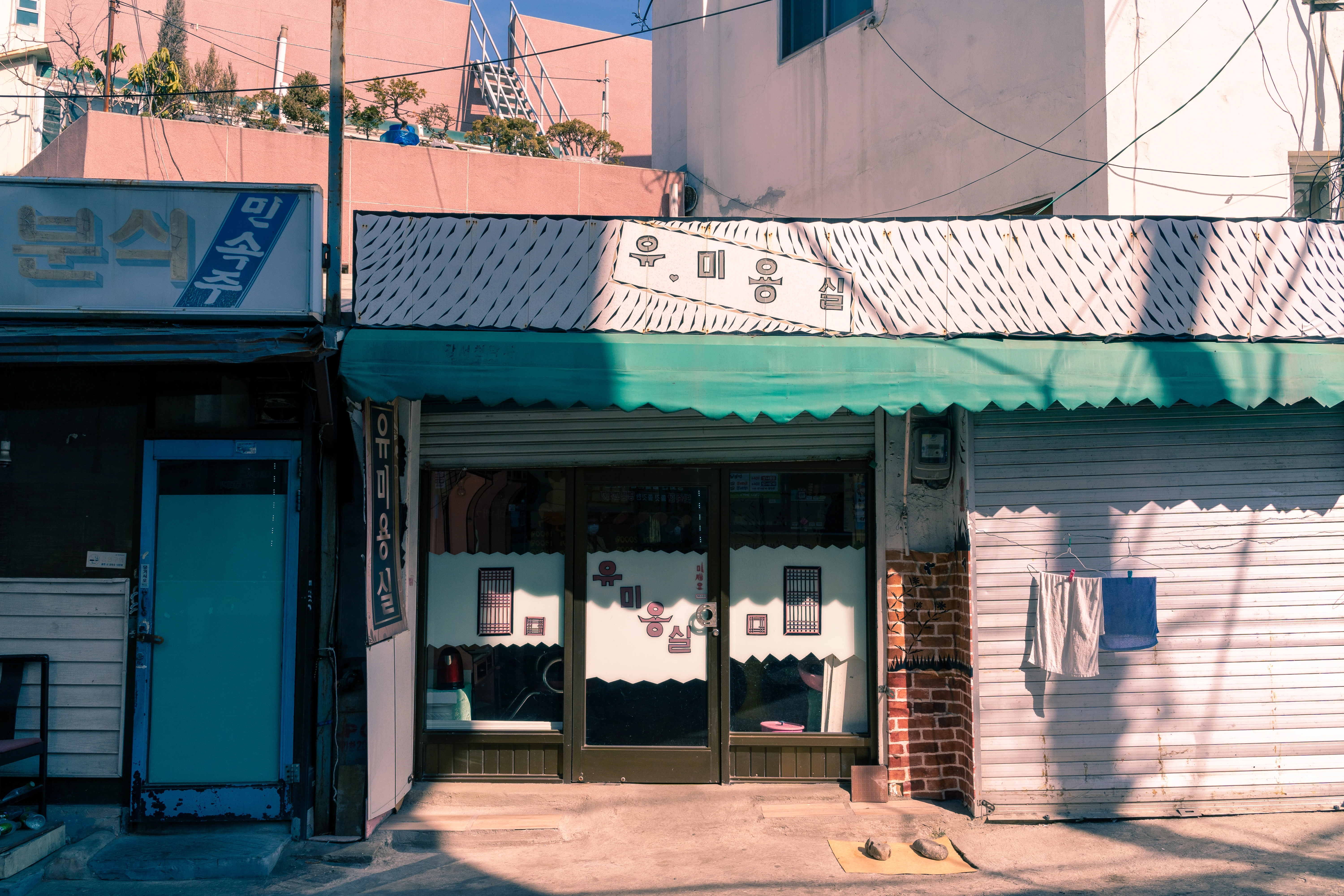 Quaint Korean Barber Shop Under Afternoon Sunlight